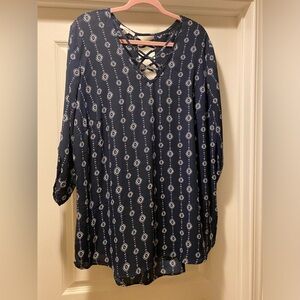 Maurices, size 2, navy and white flowy blouse with buttoned sleeve.